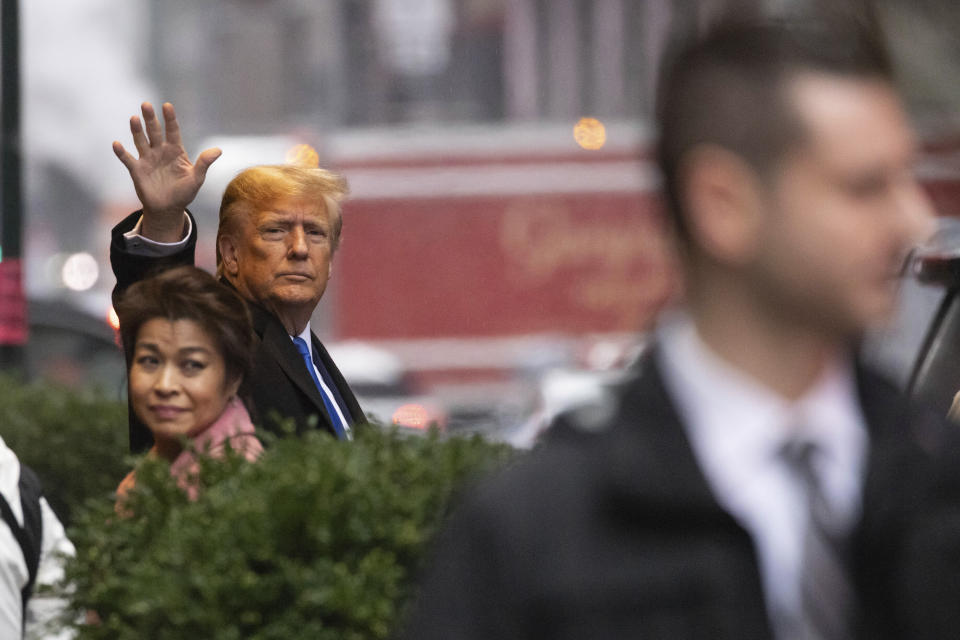 Former President Donald Trump waves while leaving his apartment building, Thursday, Jan 25, 2024, in New York. (AP Photo/Yuki Iwamura)