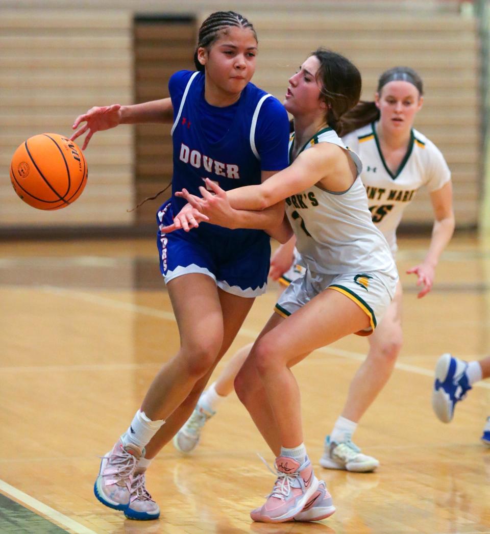 Dover's Mila Milstead (left) tries to control against St. Mark's Keira Benoit in the Spartans' 37-13 win in the opening round of the DIAA state tournament at Saint Mark’s, Wednesday, March 1, 2023.