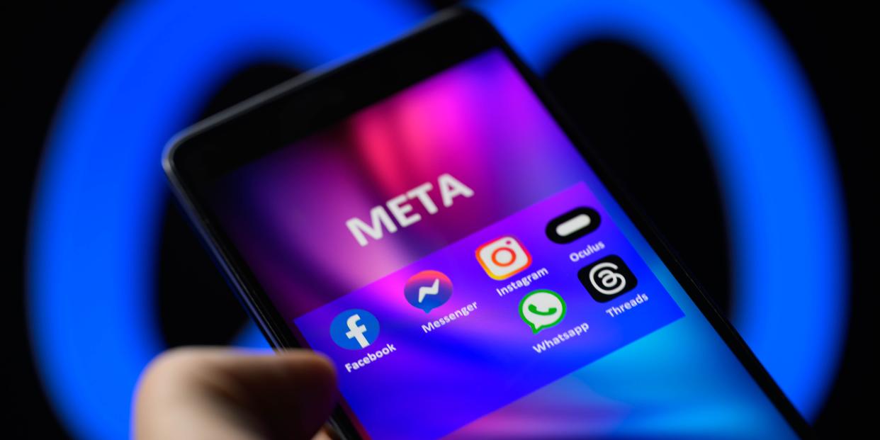 Meta logo with digital apps on phone screen
