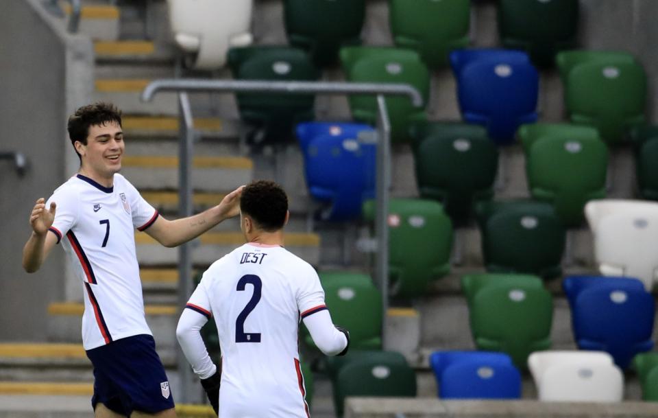 United States's Gio Reyna, left, celebrates with Sergino Dest after scoring