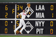 Philadelphia Phillies right fielder Nick Castellanos catches a fly out by Washington Nationals' Lane Thomas during the third inning of a baseball game, Tuesday, July 5, 2022, in Philadelphia. (AP Photo/Matt Slocum)