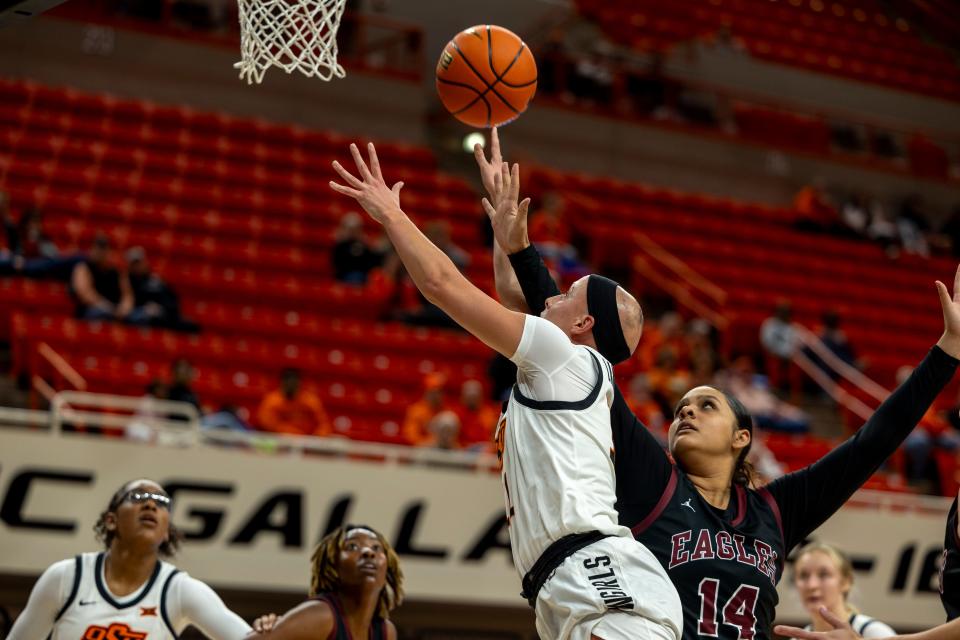 Oklahoma State 's Rylee Langerman shoots over Oklahoma Christian's Jordan Francisco during the second quarter of a womenÕs college basketball game Tuesday, Oct. 31, 2023, in Stillwater, Okla. (Mitch Alcala for the Oklahoman)