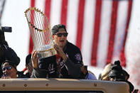 Washington Nationals first baseman Ryan Zimmerman holds up the World Series trophy during a parade to celebrate the team's World Series baseball championship over the Houston Astros, Saturday, Nov. 2, 2019, in Washington. (AP Photo/Patrick Semansky)