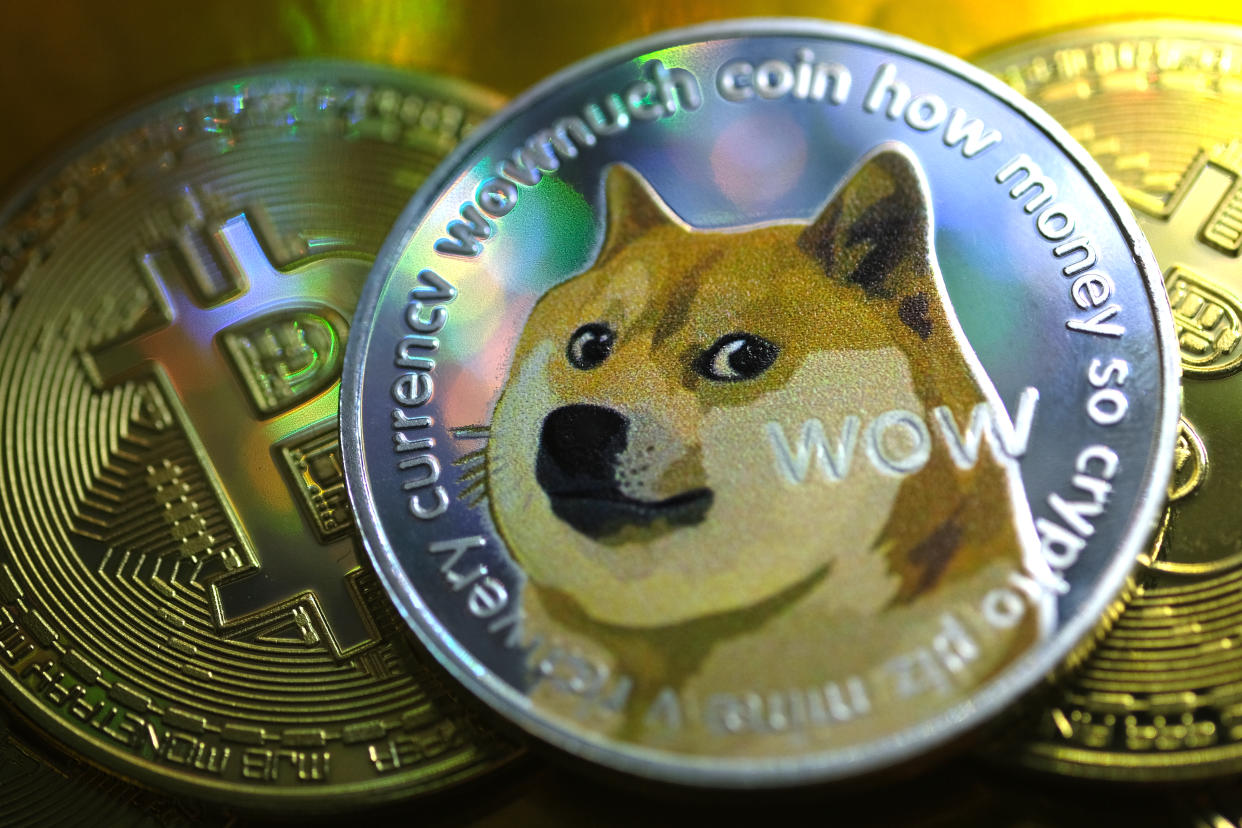 KATWIJK, NETHERLANDS - JANUARY 29: In this photo illustration visual representations of digital cryptocurrencies, Dogecoin and Bitcoin, are displayed on January 29, 2021 in Katwijk, Netherlands.  (Photo by Yuriko Nakao/Getty Images)