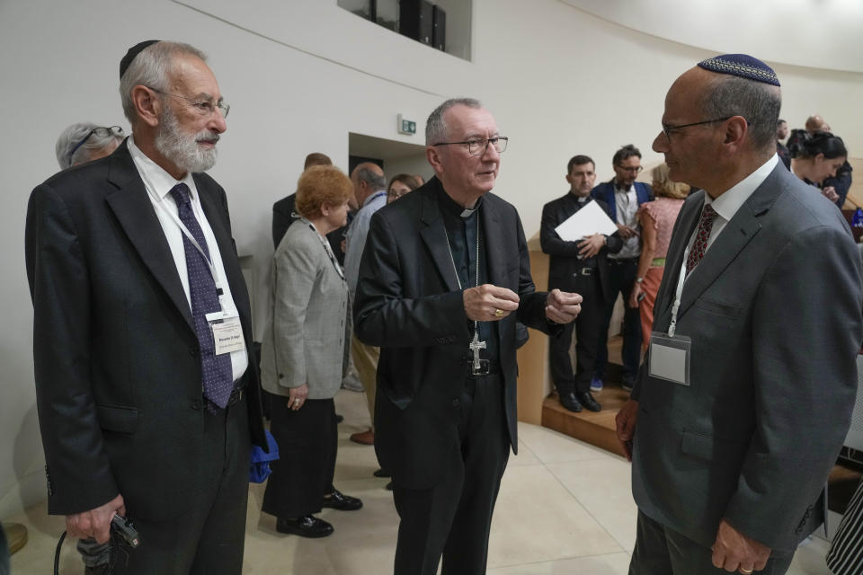 Vatican Secretary of State Pietro Parolin, centre, meets with Rabbi Noam Marans of the American Jewish Committee, right, and Rome's Chief Rabbi Riccardo Di Segni during the international conference "New documents from the Pontificate of Pope Pius XII and their Meaning for Jewish-Christian Relations: A Dialogue Between Historians and Theologians", at the Gregorian University in Rome, Monday, Oct. 9, 2023. (AP Photo/Gregorio Borgia)