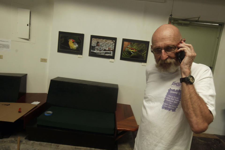 This May 27, 2013 photo shows Robert Braun, 67, of Lincoln N.H., talking with a friend in a meeting center for American retirees in Boquete, west from Panama City, Panama. Panama has become a hot spot for American retirees. They come for the natural beauty, the weather and, perhaps more important, the low cost of living. (AP Photo/Arnulfo Franco)