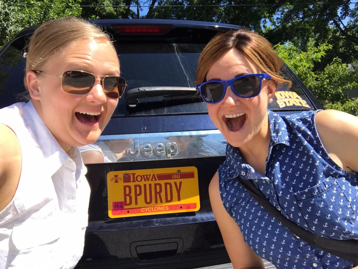 Beth Honnold, left, poses with friend Alana Olson by Honnold's Jeep, which has a license plate that makes some wonder if she's connected to former Cyclones football star Brock Purdy.
