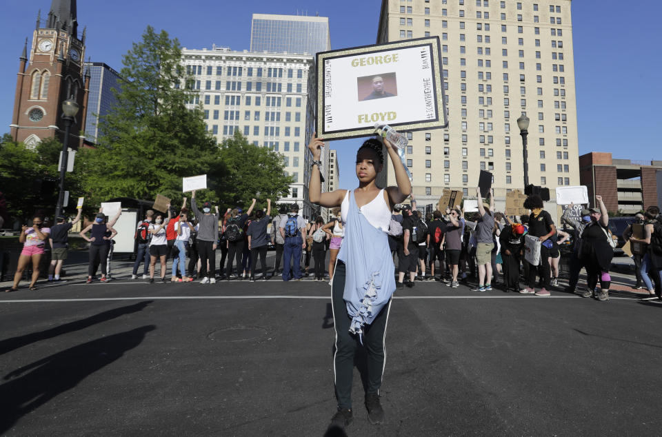 Kelly Bundy participates in a protest over the deaths of George Floyd and Breonna Taylor, Monday, June 1, 2020, in Louisville, Ky. Bundy of Louisville says most protesters are like her, peaceful people called to duty by experiences of racism and police aggression. (AP Photo/Darron Cummings)