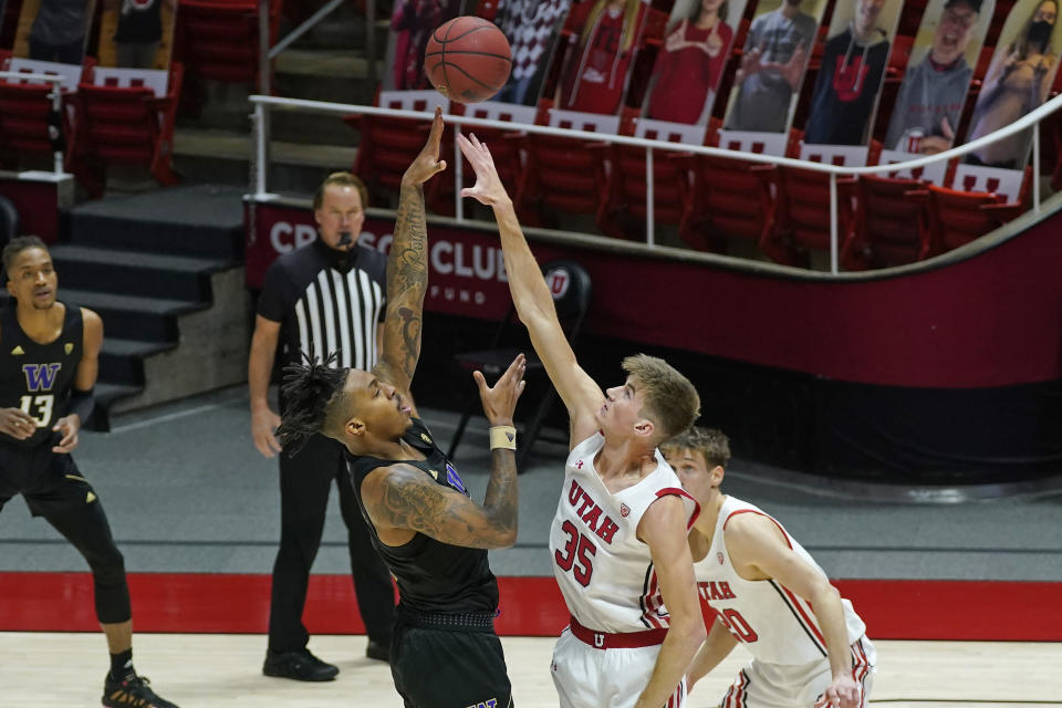 Washington forward Nate Roberts shoots over Utah center Branden Carlson (35) during the first half during an NCAA college basketball game Thursday, Dec. 3, 2020, in Salt Lake City. (AP Photo/Rick Bowmer)