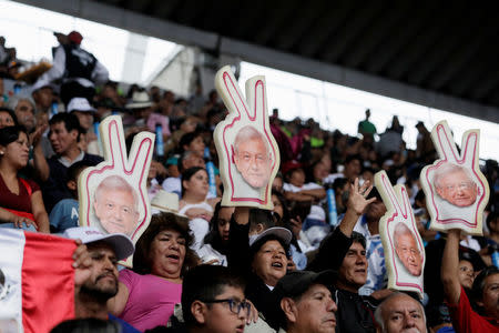 Supporters of Mexican presidential candidate Andres Manuel Lopez Obrador wait for Lopez Obrador's closing campaign rally at Azteca stadium, in Mexico City, Mexico June 27, 2018. REUTERS/Alexandre Meneghini