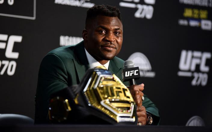 Champion Cameroon&#39;s Francis Ngannou takes questions in the press room after defeating French Cyril Gane in their UFC 270 championship fight in Anaheim on January 22, 2022. (Photo by Frederic J. BROWN / AFP) (Photo by FREDERIC J. BROWN/AFP via Getty Images)