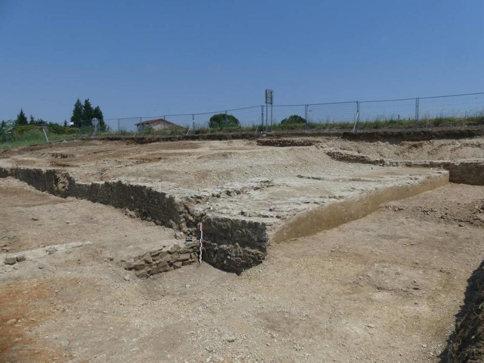 The raised platform where the wine presses were located. A basin is visible in the foreground.