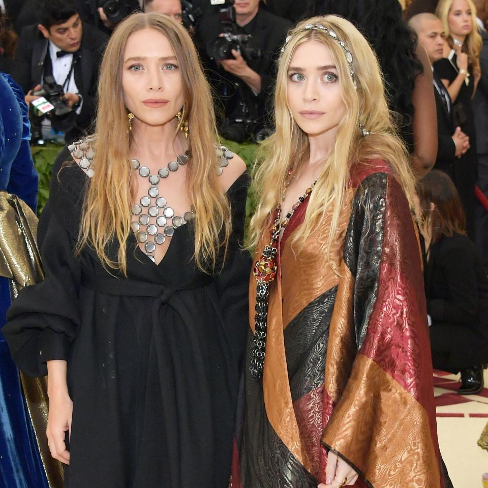 Sisters Mary-Kate and Ashley Olsen give a master class in twinning hair on the red carpet at the Met Gala 2018.