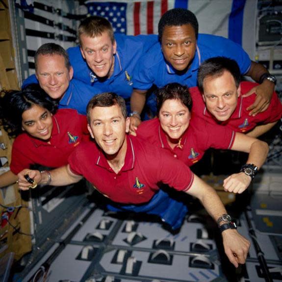 This image of the STS-107 shuttle Columbia crew in orbit was recovered from wreckage inside an undeveloped film canister. The shirt colors indicate their mission shifts. From left (bottom row): Kalpana Chawla, mission specialist; Rick Husband,