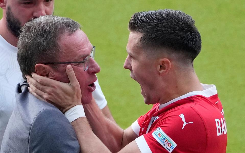 Ralf Rangnick and goalscorer Christoph Baumgartner celebrate Austria's second goal