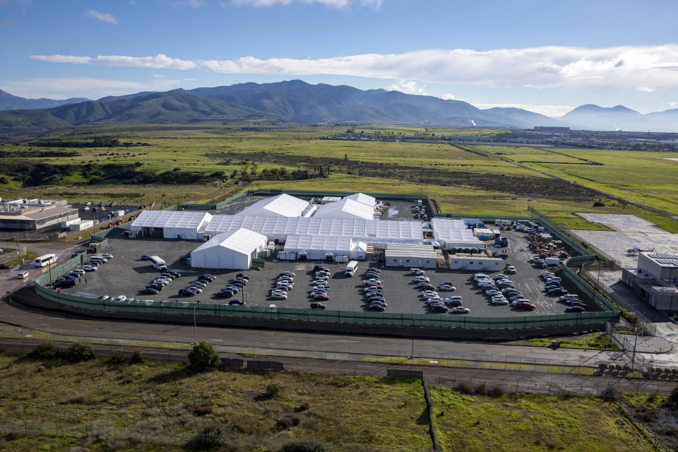 In this photo provided by U.S. Customs and Border Protection is an aerial view of the soft-sided migrant processing facility at Otay Mesa in San Diego on Jan. 31, 2023. As the Biden administration prepared to launch speedy asylum screenings at the border in April, authorities pledged a key difference from a Trump-era version of the policy: Migrants would be guaranteed access to legal representation. Nearly three months and thousands of screenings later, the promise of attorney access appears unfulfilled. (Mani Albrecht/U.S. Customs and Border Protection via AP)