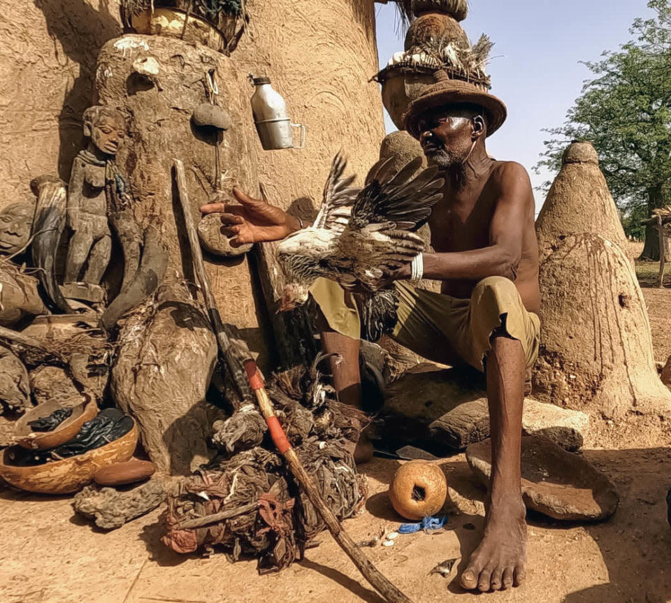 <div class="inline-image__caption"><p>A vodun practitioner in Benin handles the chicken and gin required for ritual.</p></div> <div class="inline-image__credit">Jody Bennett</div>