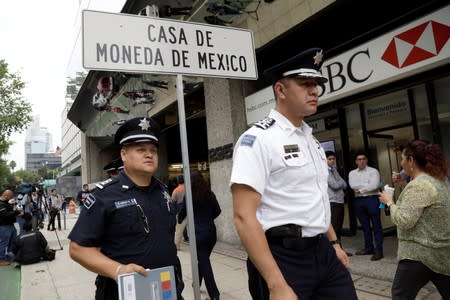 Police officers are seen during a security operation after armed robbers stole gold coins worth more than $2 million, outside Casa de Moneda in Mexico City