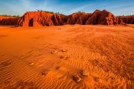 <p>Blue skies hover over the sand-covered James Price Point region in Western Australia.</p>