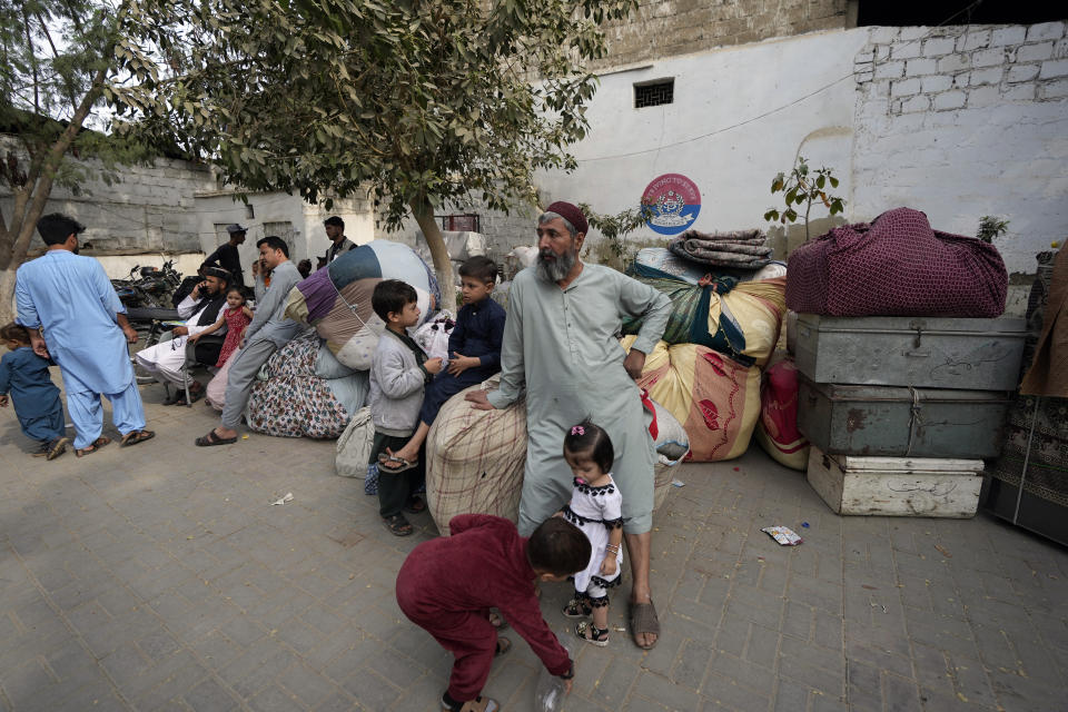 Afghans wait for transport to depart for their homeland, in Karachi, Pakistan, Friday, Nov. 17, 2023. The U.N. health agency is warning that about 1.3 million Afghans are expected to return to Afghanistan from Pakistan where authorities earlier are expelling foreigners, mostly Afghans, living in the country illegally. It had forced at least 340,000 Afghans to leave Pakistan after spending decades, officials said Friday. (AP Photo/Fareed Khan)