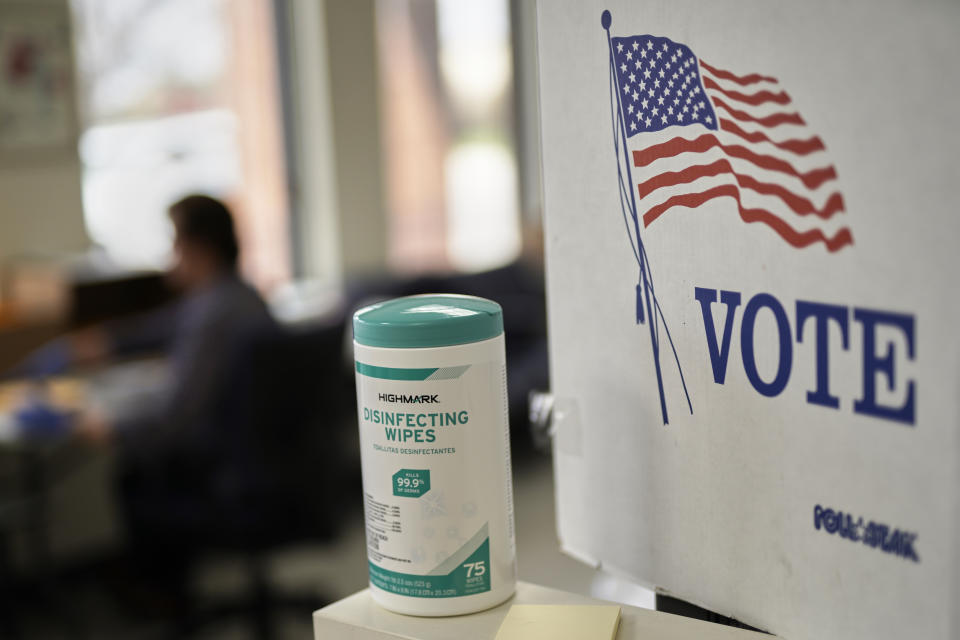 In this April 14, 2020 photo, disinfecting wipes stand at the ready at the Lancaster County Election Committee offices in Lincoln, Neb. Officials in Nebraska are forging ahead with plans for the state’s May 12 primary despite calls from Democrats to only offer voting by mail and concerns from public health officials that in-person voting will help the coronavirus spread. (AP Photo/Nati Harnik)