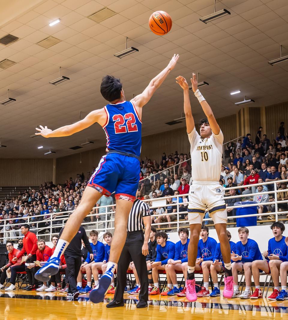 Stony Point guard Landon Short shoots a 3-pointer as Westlake guard Max Purushothaman defends during their regional quarterfinal Feb. 27. The Tigers will play their Class 6A state semifinal Friday.