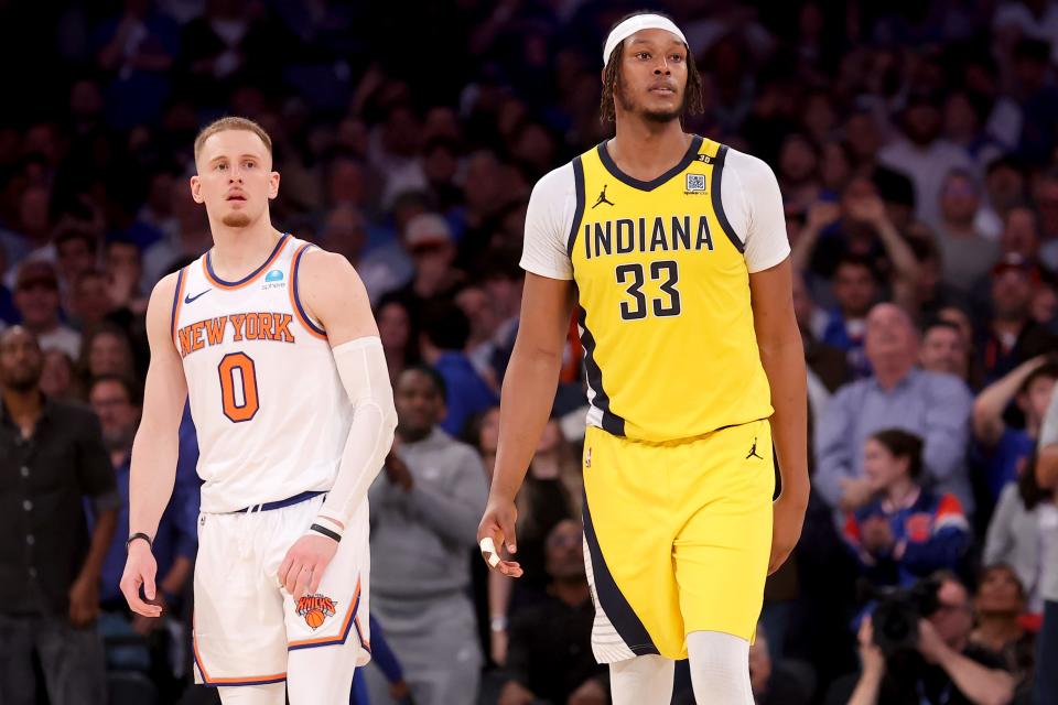 May 6, 2024; New York, New York, USA; New York Knicks guard Donte DiVincenzo (0) and Indiana Pacers center Myles Turner (33) react after Turner was called for a moving pick foul during the fourth quarter of game one of the second round of the 2024 NBA playoffs at Madison Square Garden. Mandatory Credit: Brad Penner-USA TODAY Sports