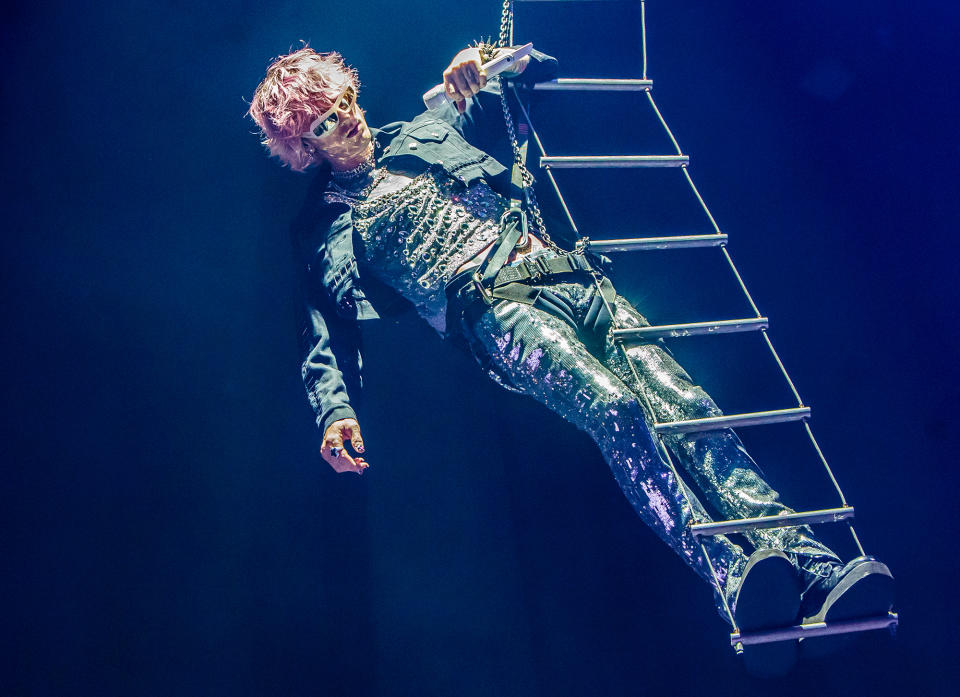 <p>Machine Gun Kelly soars above the crowd on Sept. 27 during his tour stop in Milan, Italy.</p>