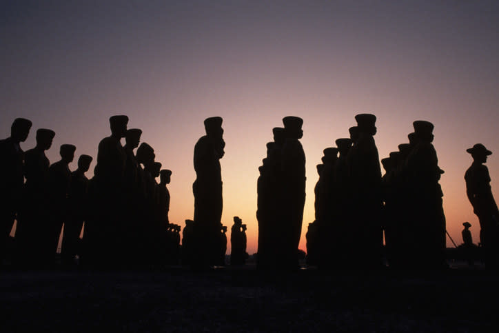 Marine recruits during boot camp at sunset