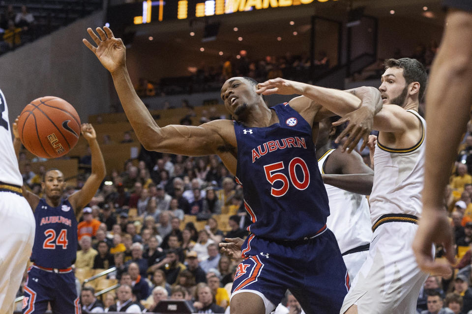 Missouri's Reed Nikko, right, and Auburn's Austin Wiley watch a rebound get away during the first half of an NCAA college basketball game Saturday, Feb. 15, 2020, in Columbia, Mo. Missouri won 85-73. (AP Photo/L.G. Patterson)