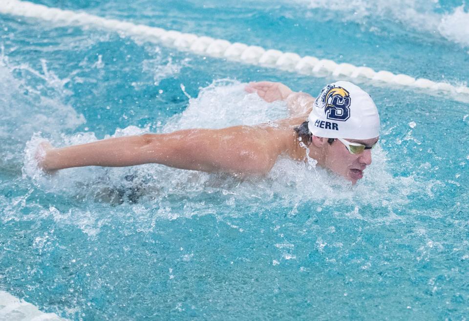 Kevin Herr, of Gulf Breeze High School, competes in the Boys 100 Yard Butterfly during the 3A District 1 Championship swim meet at the University of West Florida in Pensacola on Friday, Oct. 27, 2023.