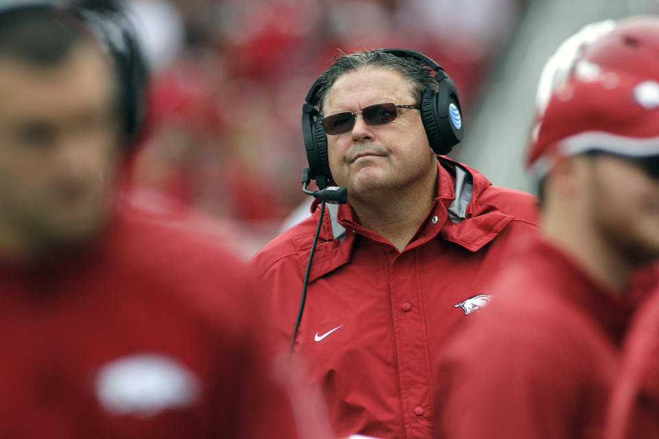 FILE - In this Saturday, Oct. 24, 2015 file photo, Arkansas' Sam Pittman watches his players run off the field during the second half of an NCAA college football game against Auburn in Fayetteville, Ark. Arkansas coach Sam Pittman knows what the resurging Razorbacks have to do to make their series against seventh-ranked Texas A&M a real rivalry again. Things have been a bit one-sided since the Aggies joined Arkansas in the Southeastern Conference. (Arkansas plays Texas A&M on Saturday, Sept. 25, 2021. AP Photo/Samantha Baker, File)