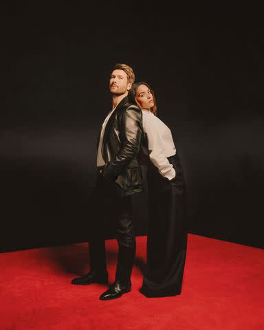 <p>Erik Carter</p> On Glen: Tom Ford jacket, shirt, pants and shoes. On Adria: Dior shirt and pants.