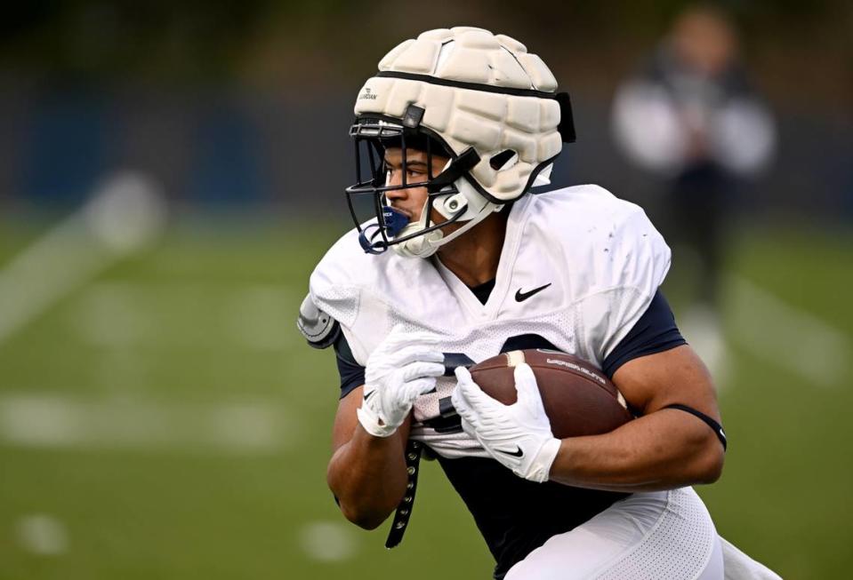 Penn State running back Ariel Davis runs a drill during practice on Tuesday, April 11, 2023.