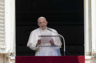 Pope Francis delivers his message during the Angelus noon prayer from the window of his studio overlooking St.Peter's Square, at the Vatican, Sunday, June 13, 2021. Francis demanded during his speech for humanitarian aid to reach residents of the war-torn Tigray region of northern Ethiopia, where Ethiopian and Eritrean soldiers are blocking food and other assistance. (AP Photo/Andrew Medichini)