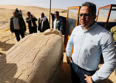 Minister of Antiquities Khaled El Anany stands near a stone sarcophagi, discovered in an ancient burial site in Minya, Egypt February 24, 2018. REUTERS/Mohamed Abd El Ghany