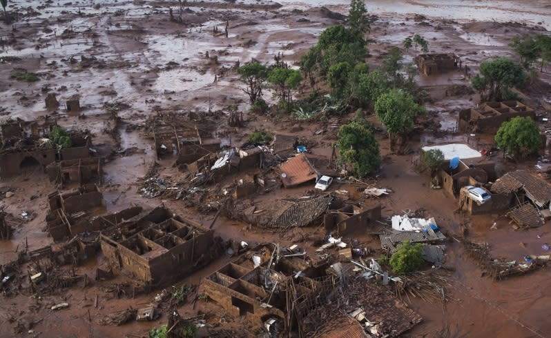 Homes lie in ruins after two dams at the Samarco iron ore mine in Brazil burst the previous day, flooding the small town of Bento Rodrigues. Picture: AP.