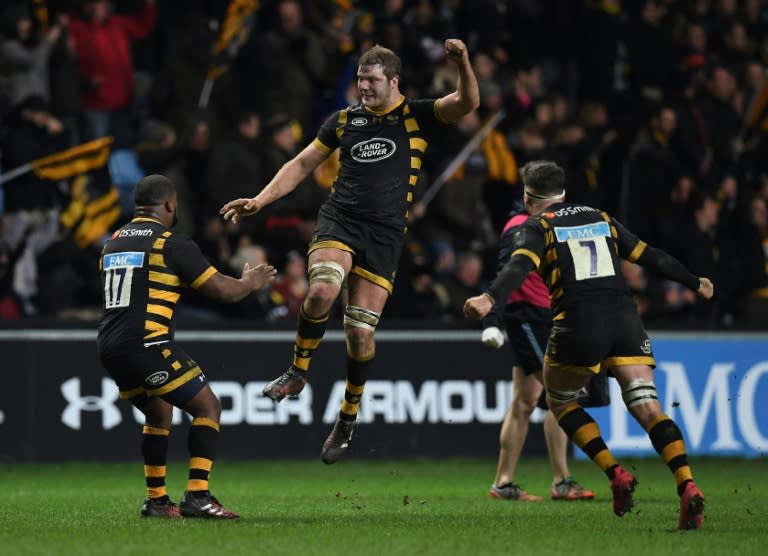 Wasps' players celebrate after winning a European Rugby Champions Cup rugby union match at The Ricoh Arena in Coventry, central England, in January 2017