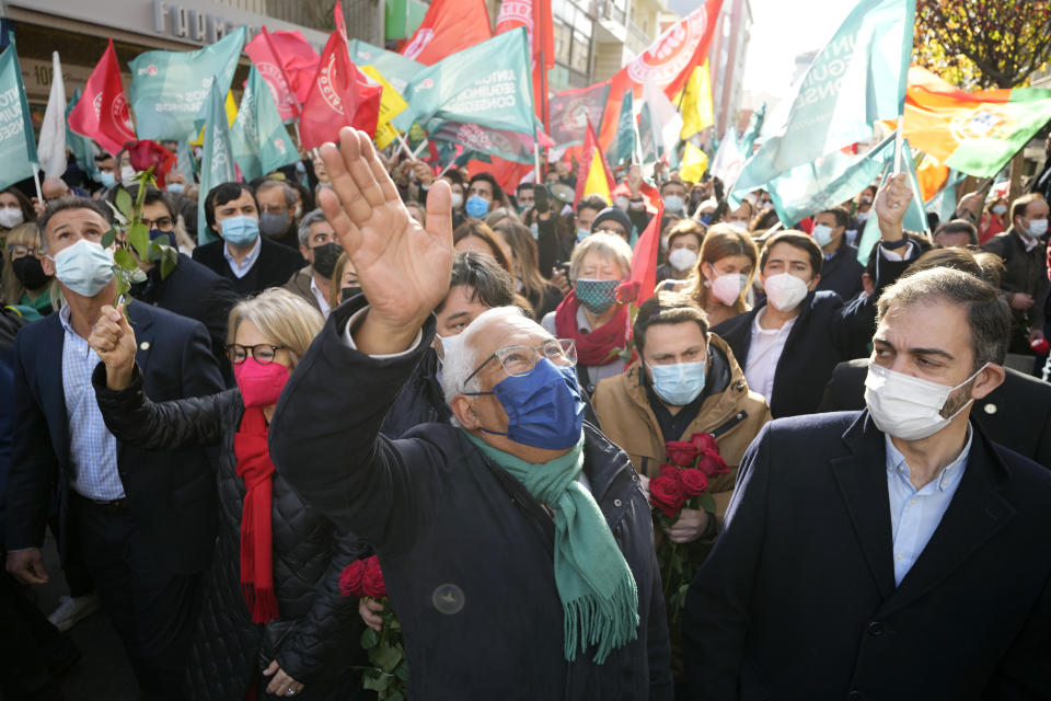 Portuguese Prime Minister and Socialist Party Secretary General Antonio Costa, center, waves during an election campaign event in the outskirts of Lisbon, Thursday, Jan. 27, 2022. Portugal holds a general election on Jan. 30. (AP Photo/Armando Franca)