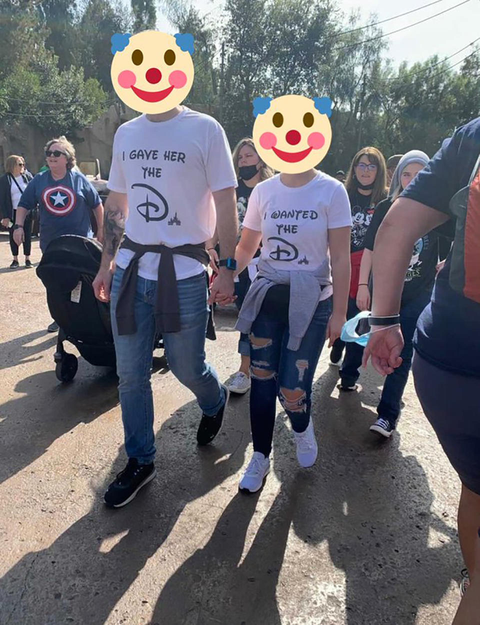 A couple wearing 'inappropriate' T-shirts at Disney World