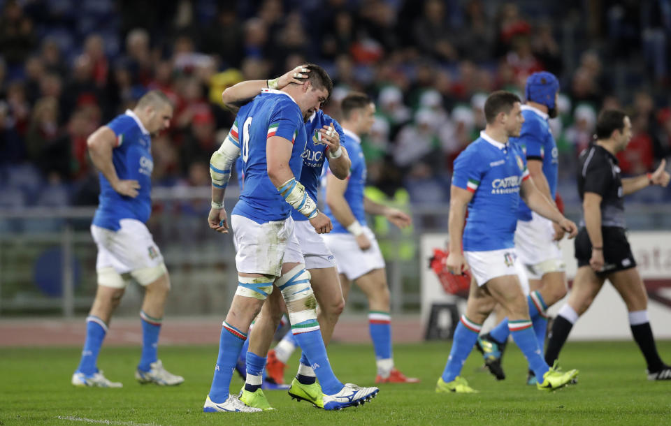 Italy players celebrate after Italy's Abraham Steyn scores a try during the Six Nations rugby union international between Italy and Wales, at Rome's Olympic Stadium, Saturday, Feb. 9, 2019. (AP Photo/Andrew Medichini)