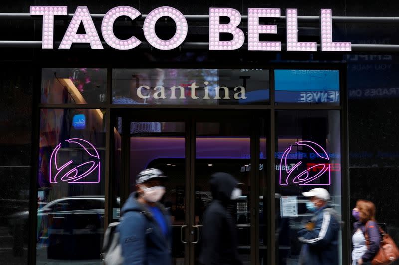 FILE PHOTO: People walk by Taco Bell's first digital-only U.S. cantina location at Times Square in New York City