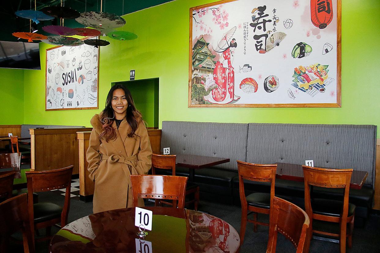 Edamame Hibachi Wings and Sushi owner Rona Simarmata stands in the new restaurant Wednesday, which is opening soon in the East Main Commerce Center. TOM E. PUSKAR/TIMES-GAZETTE.COM