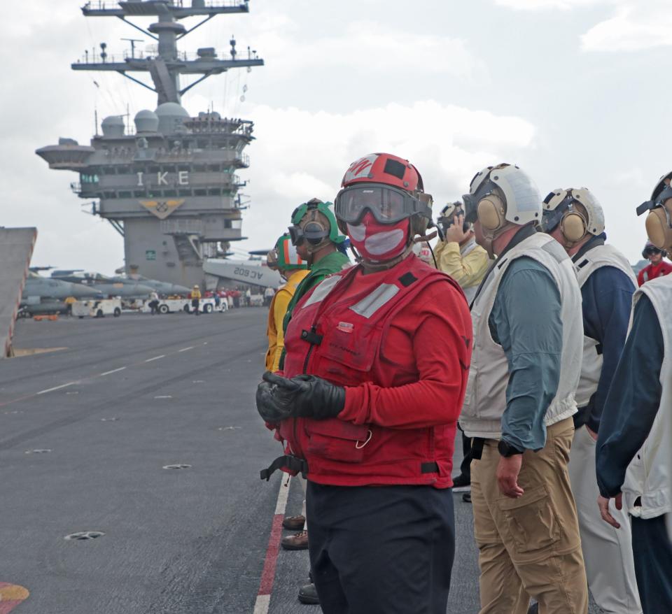 Crew members on the Navy's USS Dwight D. Eisenhower, a nuclear-powered aircraft carrier, in the Atlantic Ocean, Friday, June 30, 2023. News-Journal photographer Nadia Zomorodian recently spent 24 hours on the ship.