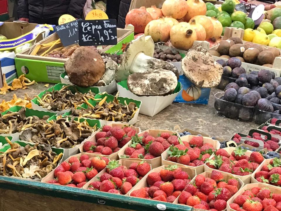 trays of fruits and veggies at bastille market in paris