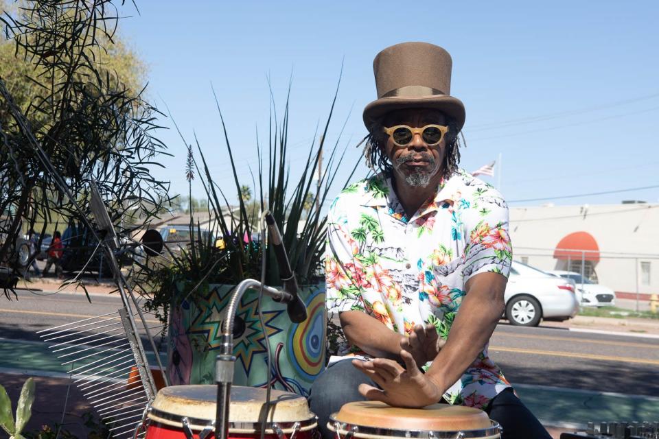 Local artist Joe Willie Smith provides percussion on Grand Avenue in Phoenix on March 16, 2019, during Art Detour.