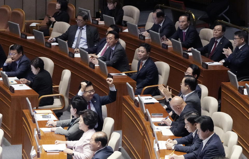 The ruling People Power Party's lawmakers react as the parliament passed a motion to approve main opposition Democratic Party leader Lee Jae-myung's arrest warrant at the National Assembly in Seoul, South Korea, Thursday, Sept. 21, 2023. (AP Photo/Ahn Young-joon)