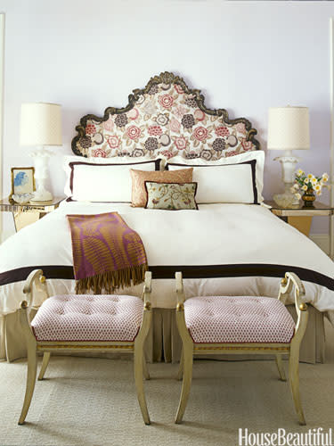 bed with ornate headboard