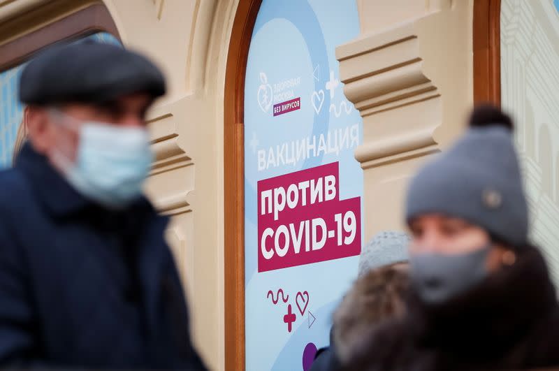 People are seen outside a vaccination centre in the State Department Store, GUM, in Moscow