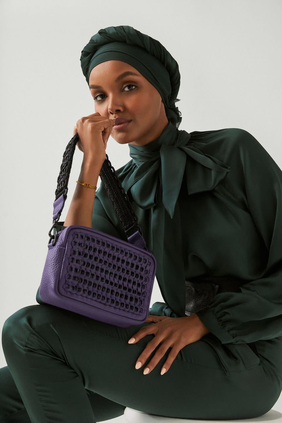 a woman sitting on a bench